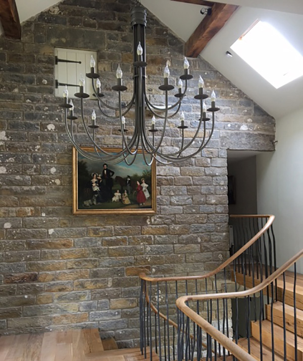 A chandelier to complement a staircase in this Yorkshire farmhouse