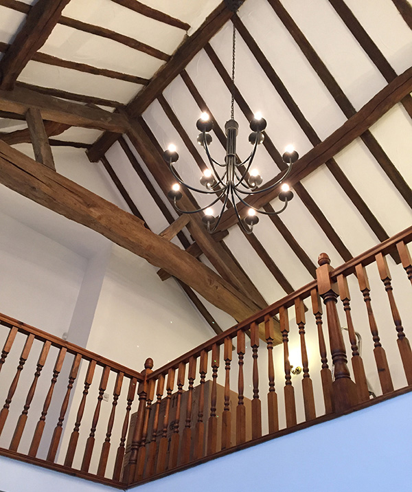 Our Hartcliff chandelier in a timbered roof space