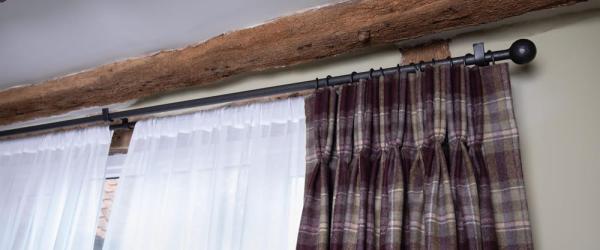 How the Materials Compare When Choosing the Right Curtain Pole