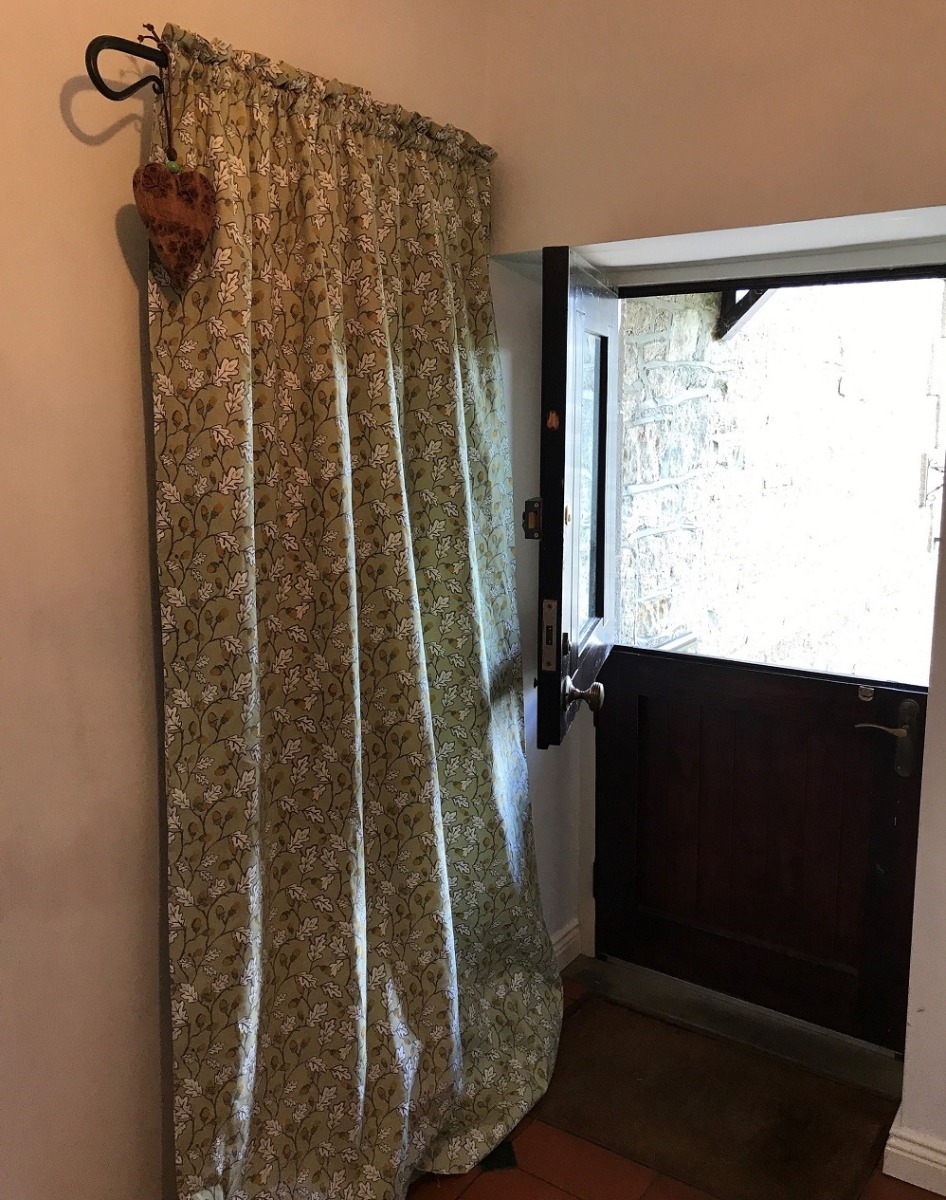 Nigel Tyas portiere fitted with double sided curtain