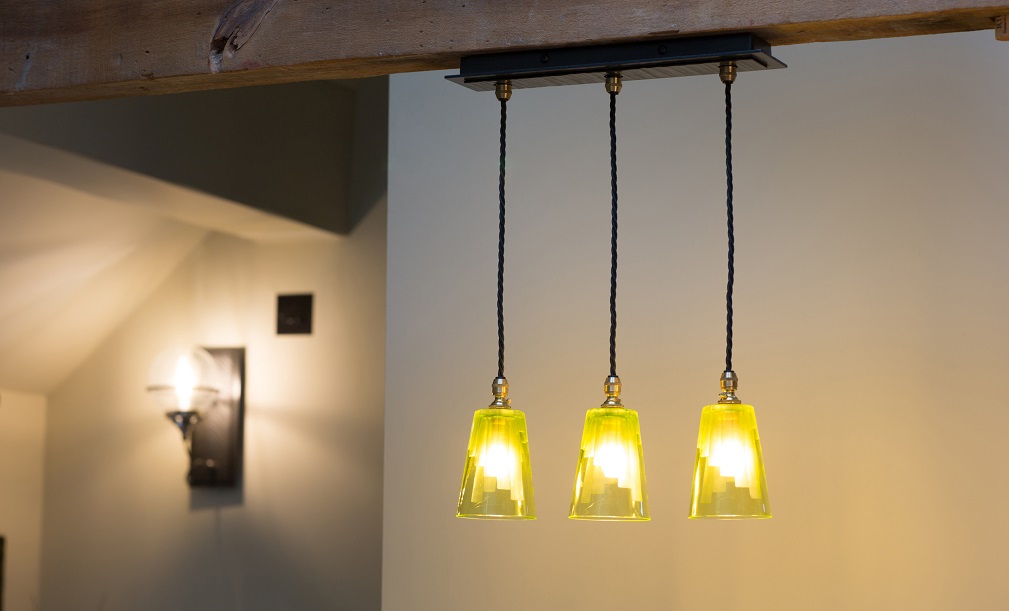 Our Cobcar three-light pendant with handforged ceiling plate