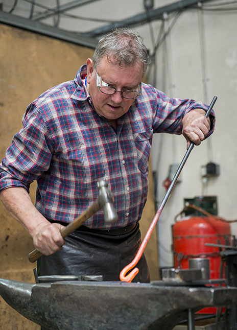 Nigel Tyas working at the anvil